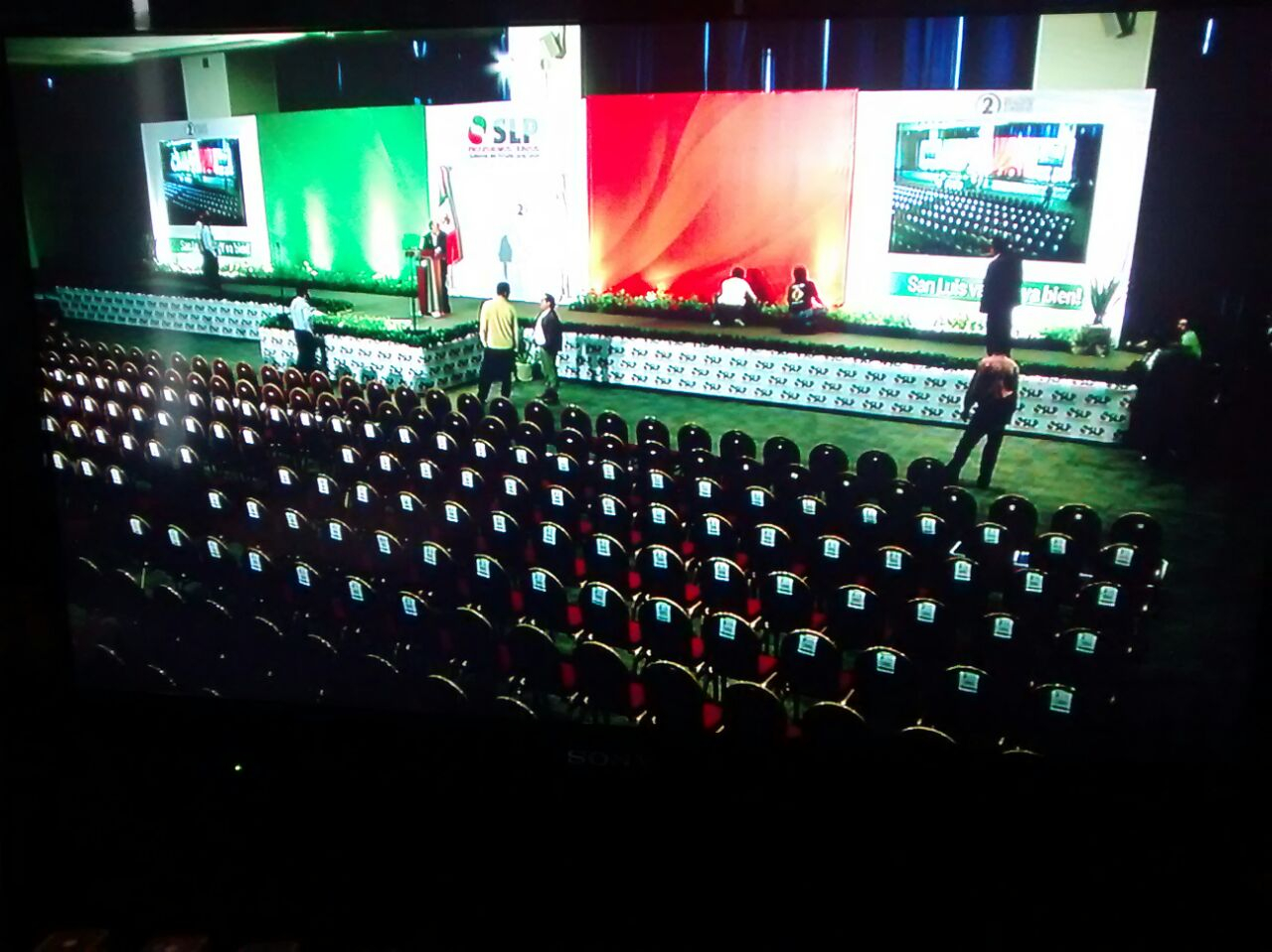 Conference stage with delegate seating prepared for interpreted session